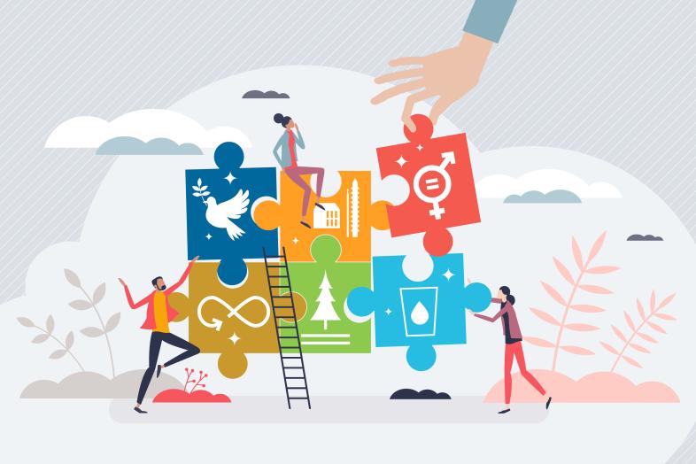 Ihmisiä rakentamassa palapeliä värikkäistä paloista, jotka symboloivat kestävän kehityksen tavoitteita.