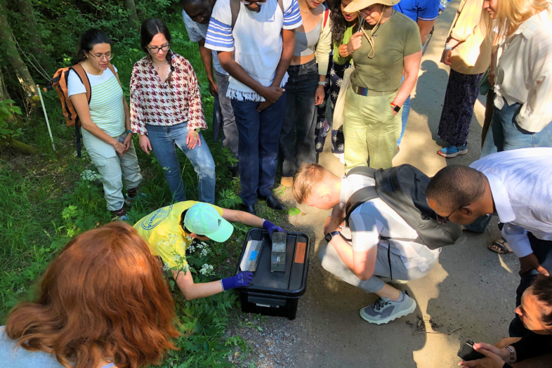 students exploring a device